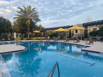 Resort-inspired pool with lap lane and heated jacuzzi
